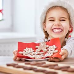 little girl cooking Christmas biscuits